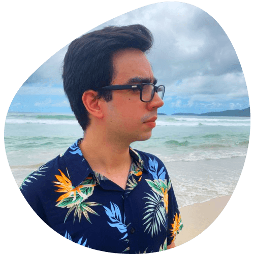 In this picture, it's me using a Hawaiian shirt, and the sand, ocean, and skies in the background demonstrate that I am on the beach.
